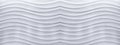 Panorama of white concrete wall with a wave line pattern